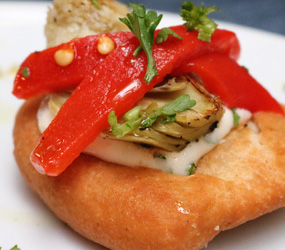 Coconut arepas with artichokes and peppers